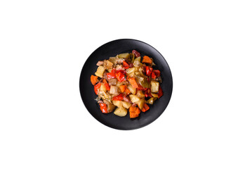 Vegetable stew or ratatouille with eggplant, tomatoes, sweet and hot peppers, onions, carrots and spices in plate