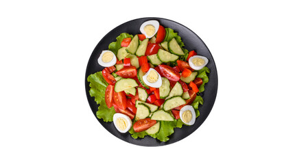 Lettuce, cucumber, spinach, tomato and quail eggs salad with herbs and lemon