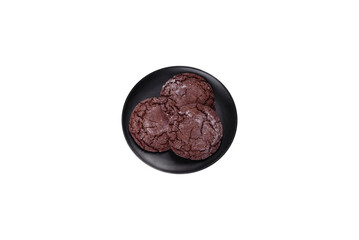 Delicious fresh chocolate biscuits on a dark concrete background with Christmas toys