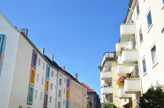 apartment buildings with balconies and blue sky, urban city life in germany, hanover