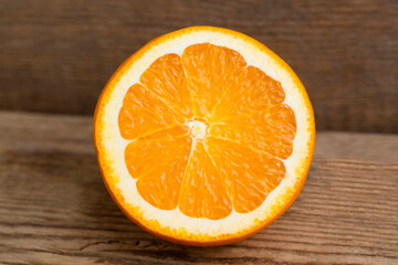 Sliced orange on wooden background