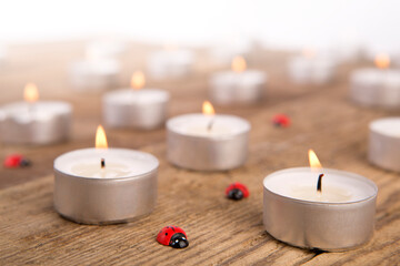 Fototapeta na wymiar Candles with ladybugs