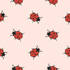 Beautiful seamless pattern of ladybug beetles on pink background. Look other samples in collection