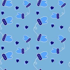 Seamless pattern of winter warm gloves on a blue background