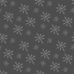 Seamless pattern of winter snowflakes on a gray background