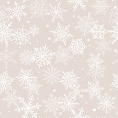 Christmas seamless pattern of beautiful complex snowflakes in beige and white colors. Winter background with falling snow