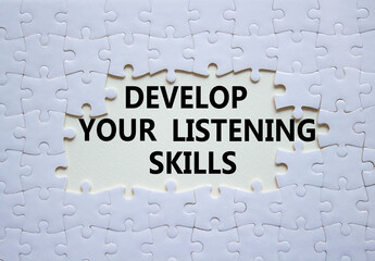 Listening skills symbol. Concept word Develop active listening skills on white puzzle. Beautiful...