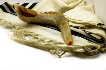 Shofar (horn) and Tallit jewish traditional symbols .Shofar , Tallit  on white background. Rosh...