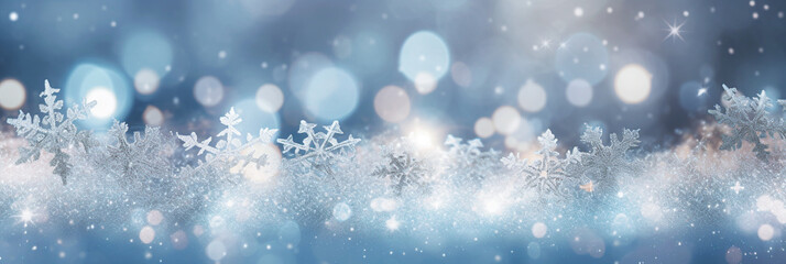 defocused Christmas background with snowflakes and bokeh lights, banner.  