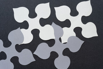 spade-like quadrilateral machine-cut paper designs or shapes on blank paper