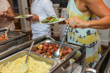 hand delicately savoring food, representing the joy and sensory pleasure of culinary indulgence