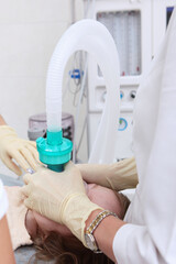 Child is under anesthesia. Breathing tube in child's mouth. Open mouth. Modern dentistry.An...