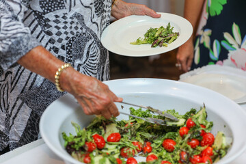 hand delicately savoring food, representing the joy and sensory pleasure of culinary indulgence