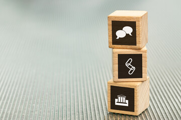 Business contacts, supply chains, building foundations of a strong and stable company, Business concept, wooden blocks with enterprise goals icons, copy space