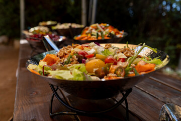 salad on a plate and several salads around
