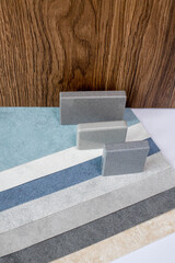 Samples of materials for interior design. Fabric wallpaper, samples of artificial stone, wood