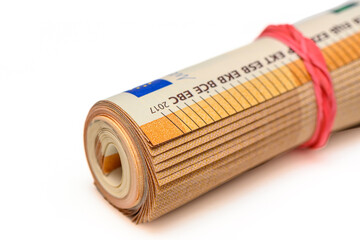 euros rolled into a tube, 50 euro bills on a white background 16