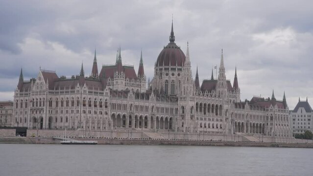 River view of the Hungarian Parliament building in Budapest. Slow motion. 