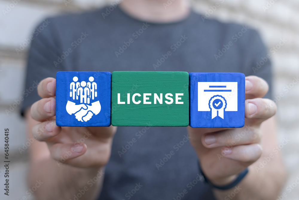 Poster man holding colorful styrofoam blocks with icons and text: license. licensing. license agreement bus