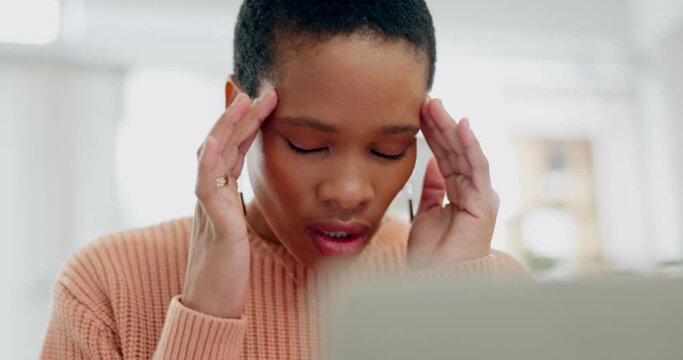Woman, remote work and headache at laptop with stress, burnout and brain fog. Face of tired african person, sad freelancer and frustrated with migraine, pain and fatigue at computer in home office