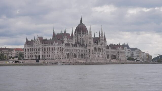 Boat view of the Hungarian Parliament building in Budapest. Slow motion. 