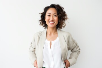 Lifestyle portrait photography of a Vietnamese woman in her 30s against a white background