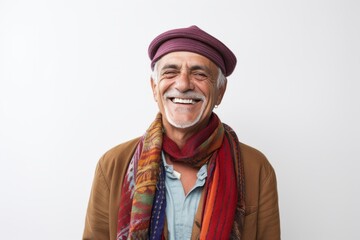 Fototapeta premium Lifestyle portrait photography of a Peruvian man in his 60s wearing a foulard against a white background
