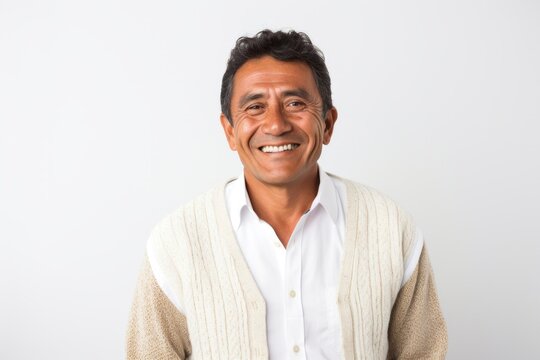 Portrait photography of a Peruvian man in his 50s against a white background