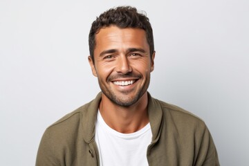 Lifestyle portrait photography of a Colombian man in his 30s against a white background