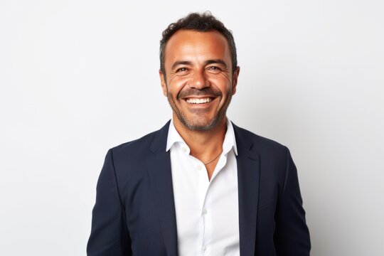 Portrait photography of a Colombian man in his 40s against a white background