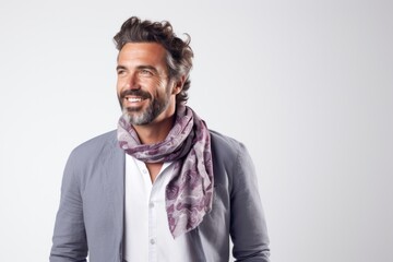 Obraz premium Lifestyle portrait photography of a Italian man in his 30s wearing a foulard against a white background