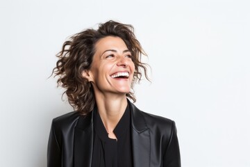 Obraz na płótnie Canvas Lifestyle portrait photography of a Italian woman in her 40s wearing a sleek suit against a white background