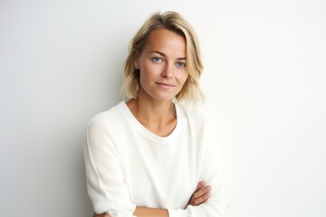 Medium shot portrait photography of a Swedish woman in her 30s against a white background