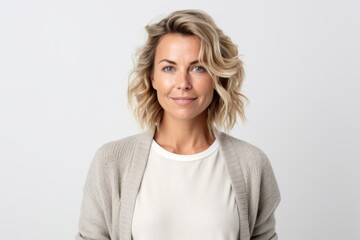 Medium shot portrait photography of a Swedish woman in her 30s against a white background