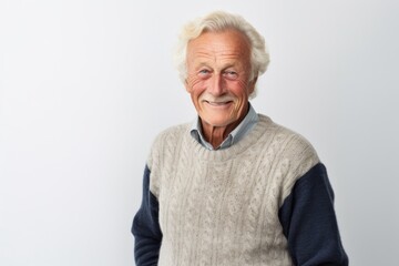 Lifestyle portrait photography of a Swedish man in his 70s against a white background