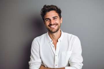 Portrait photography of a French man in his 20s against a minimalist or empty room background