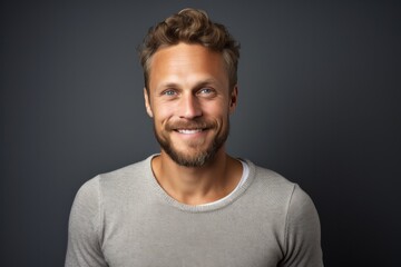 Fototapeta premium Close-up portrait photography of a Swedish man in his 30s against a minimalist or empty room background