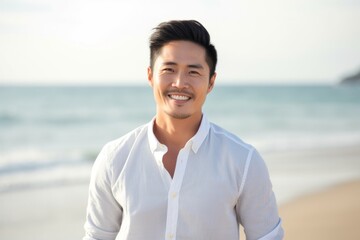 Medium shot portrait photography of a Vietnamese man in his 30s against a beach background