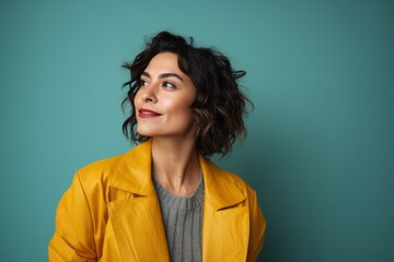 Fototapeta premium Medium shot portrait photography of a Peruvian woman in her 30s against an abstract background