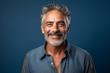 Fototapeta premium Portrait photography of a Colombian man in his 50s against an abstract background