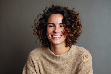 Fototapeta premium Medium shot portrait photography of a Italian woman in her 30s wearing a cozy sweater against an abstract background