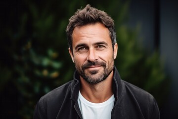 Fototapeta premium Medium shot portrait photography of a Italian man in his 30s against an abstract background