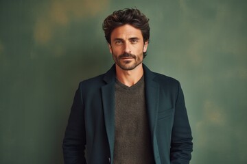 Portrait photography of a Italian man in his 30s against an abstract background