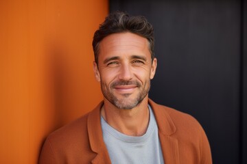 Fototapeta premium Portrait photography of a Italian man in his 30s against an abstract background