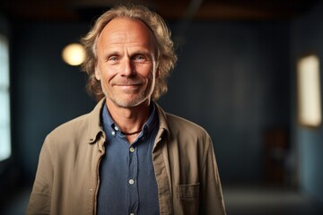 Medium shot portrait photography of a Swedish man in his 50s against an abstract background
