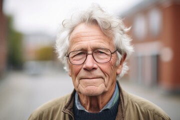Medium shot portrait photography of a Swedish man in his 70s wearing a simple tunic against an abstract background
