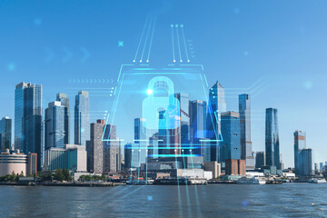 New York City skyline from New Jersey over the Hudson River towards the Hudson Yards at day. Manhattan, Midtown. The concept of cyber security to protect confidential information, padlock hologram