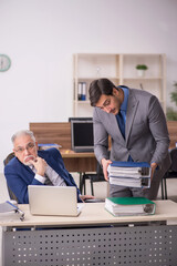 Two male colleagues working in the office