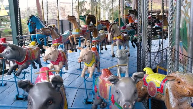 Carousel with horses by Herschell Spillman and pigs by Gustave Bayol