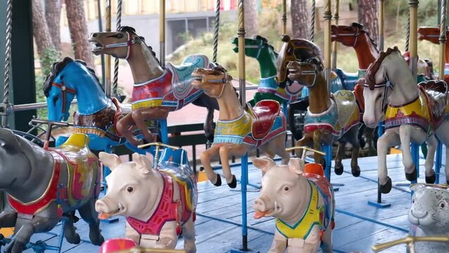 Carousel with horses by Herschell Spillman and pigs by Gustave Bayol
